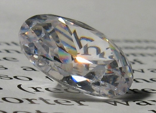 Diamond sitting on written page